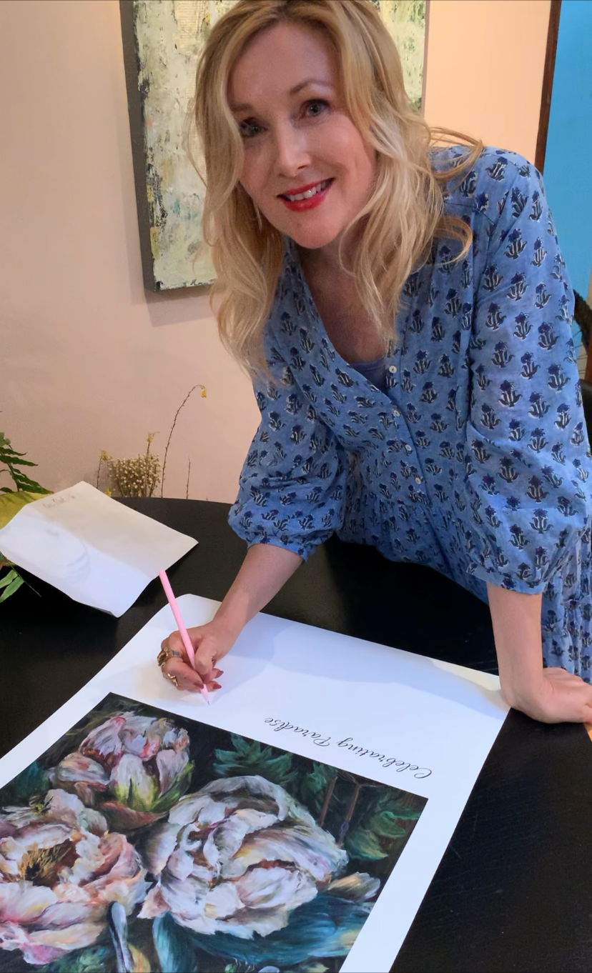 Celebrating Paradise Print being signed by Kim Black - Ruthanne Collection